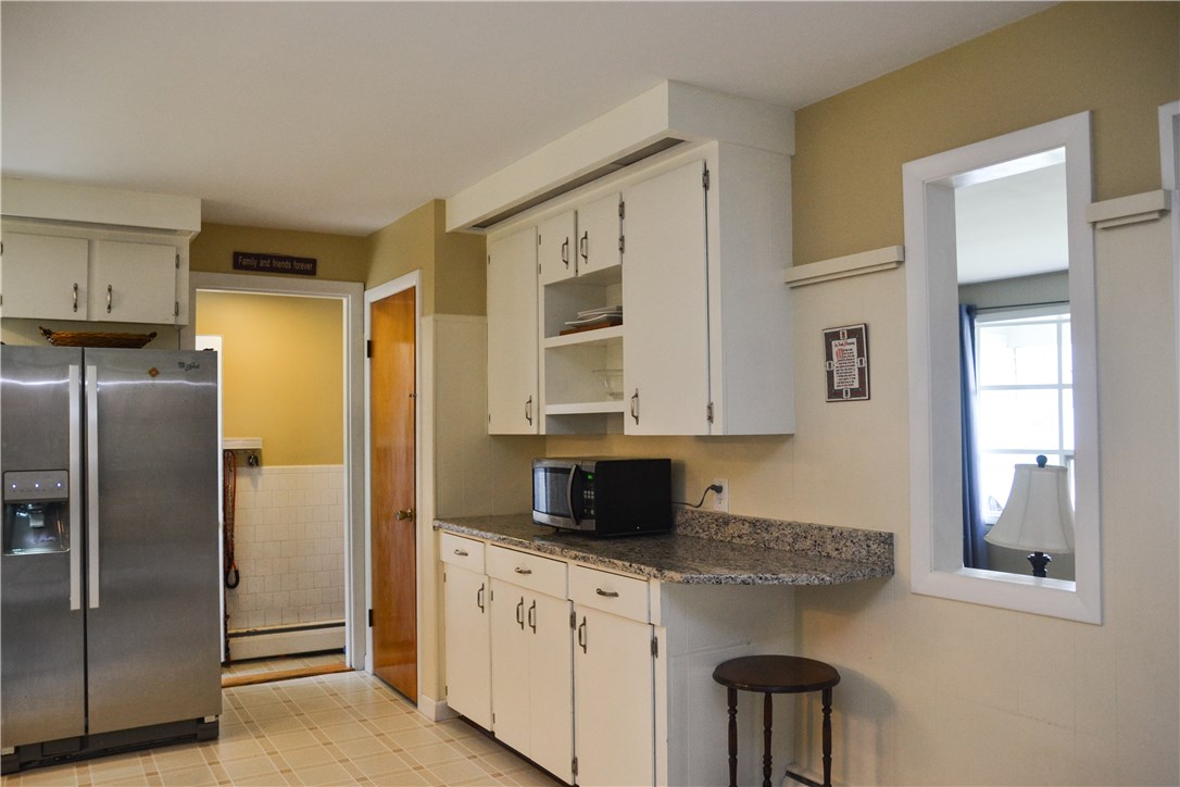 1379 Hope Road Cranston, RI 02831 - Photo 10 of 28 To mudroom area - turn left to go outside and enjoy the private yard or turn right to the Garage entrance