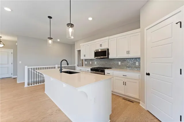 $336,695 | 1210 Southeast Windbreak Drive, Lee's Summit, MO 64081