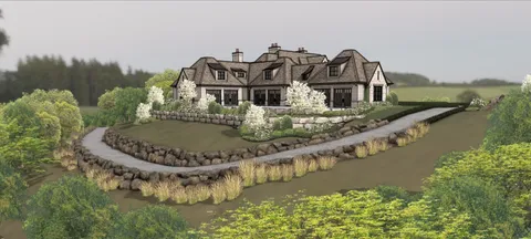 an aerial view of a house with outdoor space