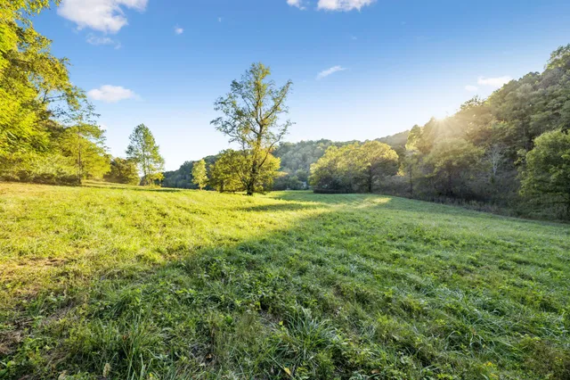 an aerial view of a house with a yard basket ball court and outdoor seating