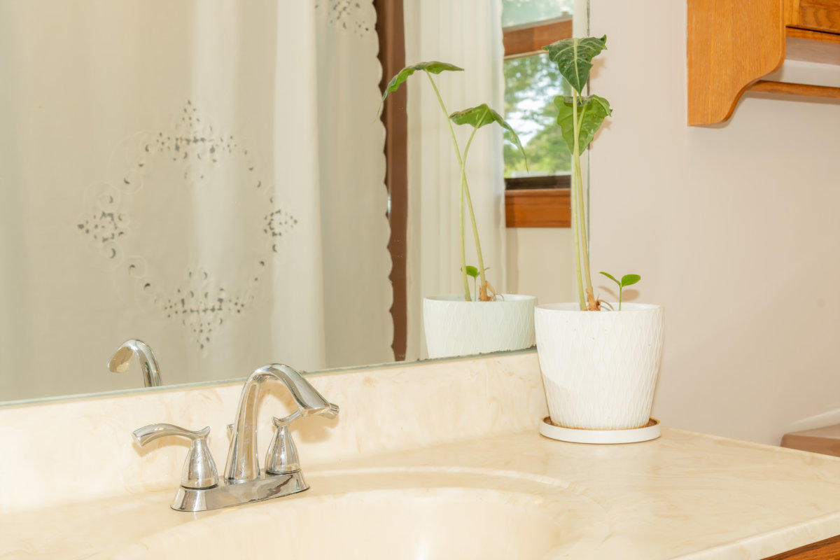 636 Lumbert Mill Road Centerville, MA 02632 - Photo 11 of 23 a bathroom with a sink and a mirror