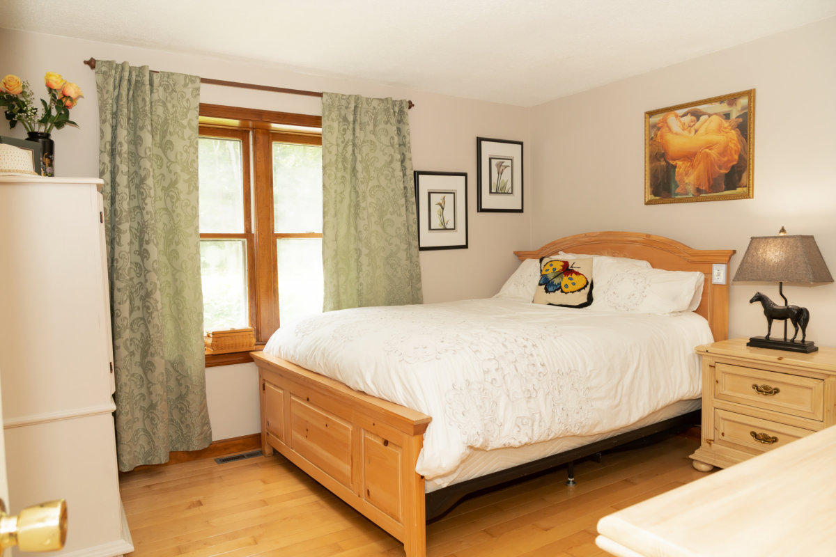 636 Lumbert Mill Road Centerville, MA 02632 - Photo 12 of 23 a bed sitting in a bedroom next to a window