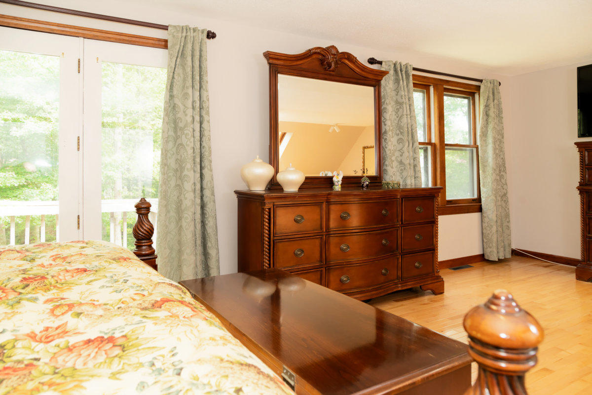 636 Lumbert Mill Road Centerville, MA 02632 - Photo 15 of 23 a bed room with a bed and a chair