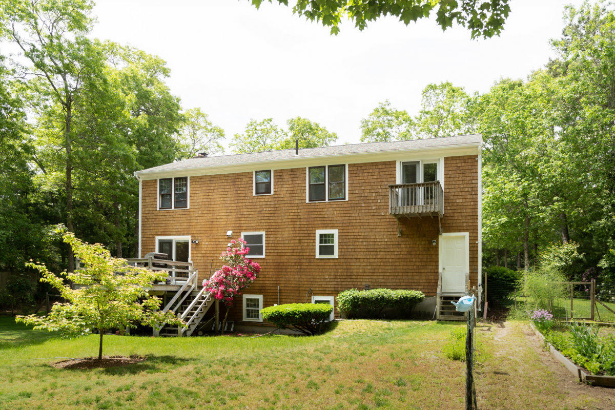 636 Lumbert Mill Road Centerville, MA 02632 - Photo 22 of 23 a view of a house with backyard