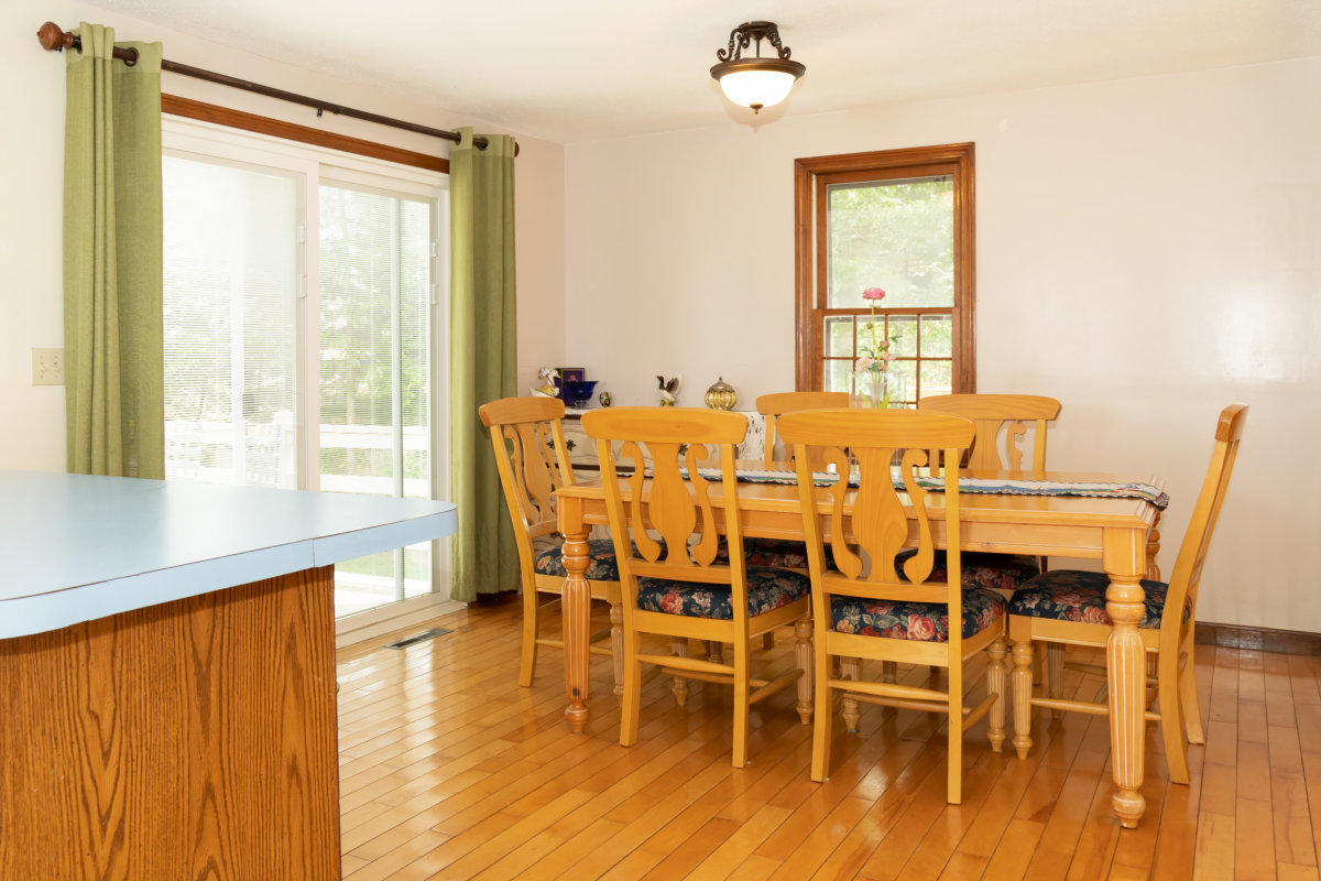 636 Lumbert Mill Road Centerville, MA 02632 - Photo 6 of 23 a view of a dining room with furniture and wooden floor