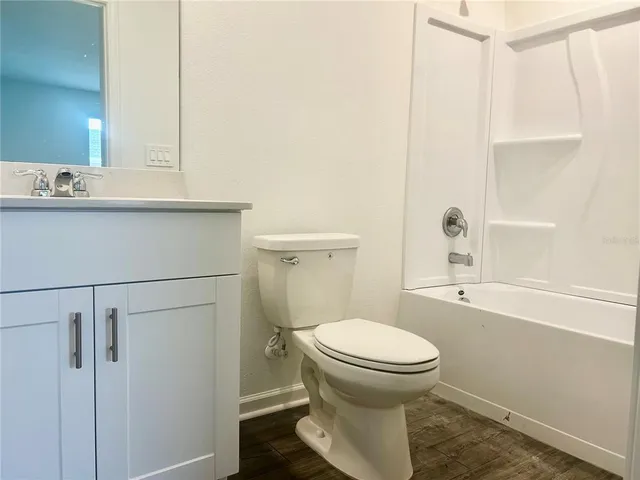 a bathroom with a toilet and a sink