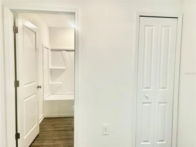 a view of a bathroom with a glass door