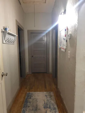 a bedroom with a bed and a chair