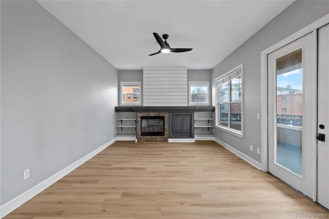 a view of a livingroom with wooden floor