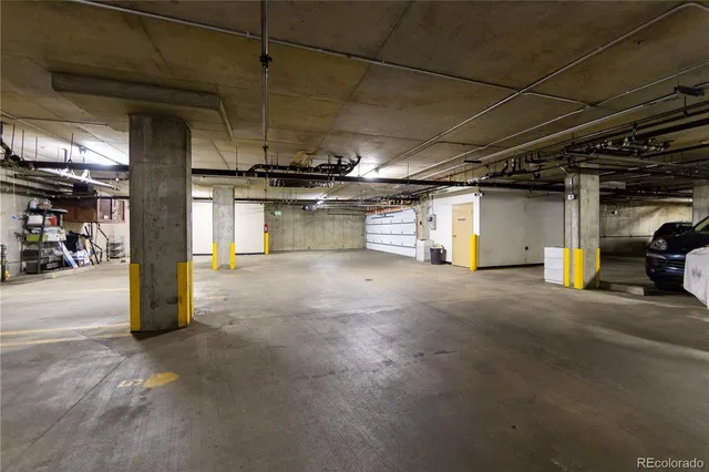 a view of parking garage with cars