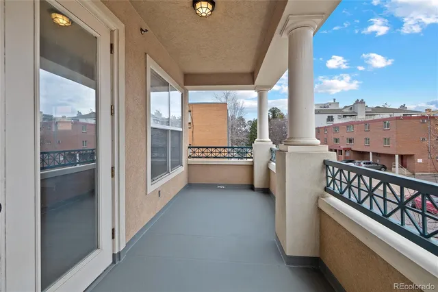 a view of a balcony with wooden floor and outdoor space