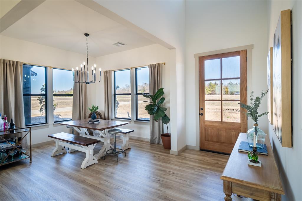 375 Wolf Front Road Van Alstyne, TX 75495 - Photo 13 of 40 a living room with furniture and a chandelier
