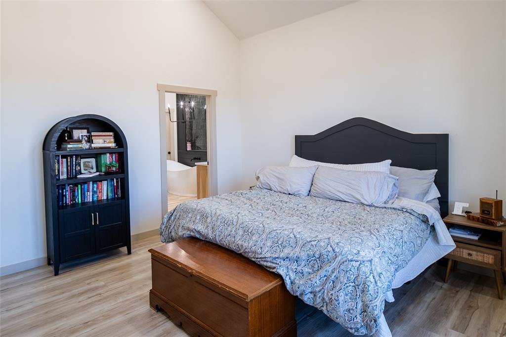 375 Wolf Front Road Van Alstyne, TX 75495 - Photo 14 of 40 a bedroom with a bed and a dresser