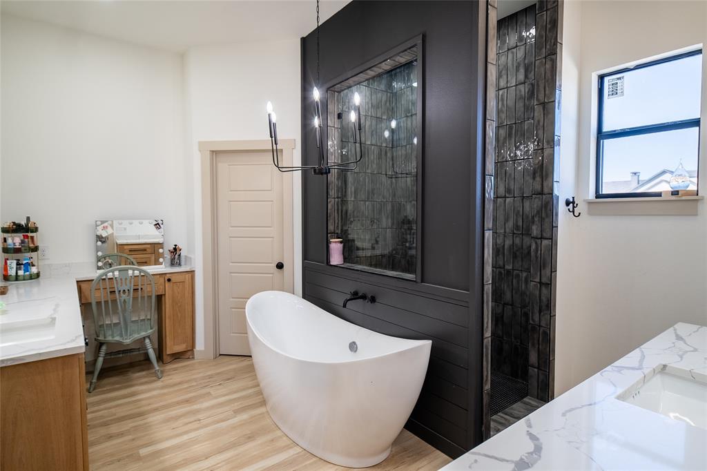 375 Wolf Front Road Van Alstyne, TX 75495 - Photo 17 of 40 a bathroom with a bathtub and shower