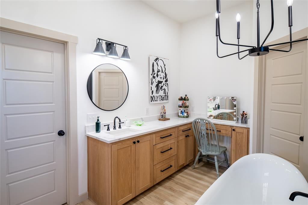 375 Wolf Front Road Van Alstyne, TX 75495 - Photo 19 of 40 a bathroom with a sink a toilet and a mirror