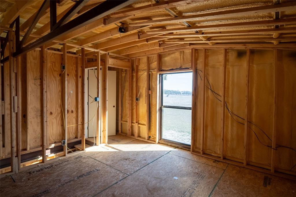 375 Wolf Front Road Van Alstyne, TX 75495 - Photo 22 of 40 a view of a room with wooden walls