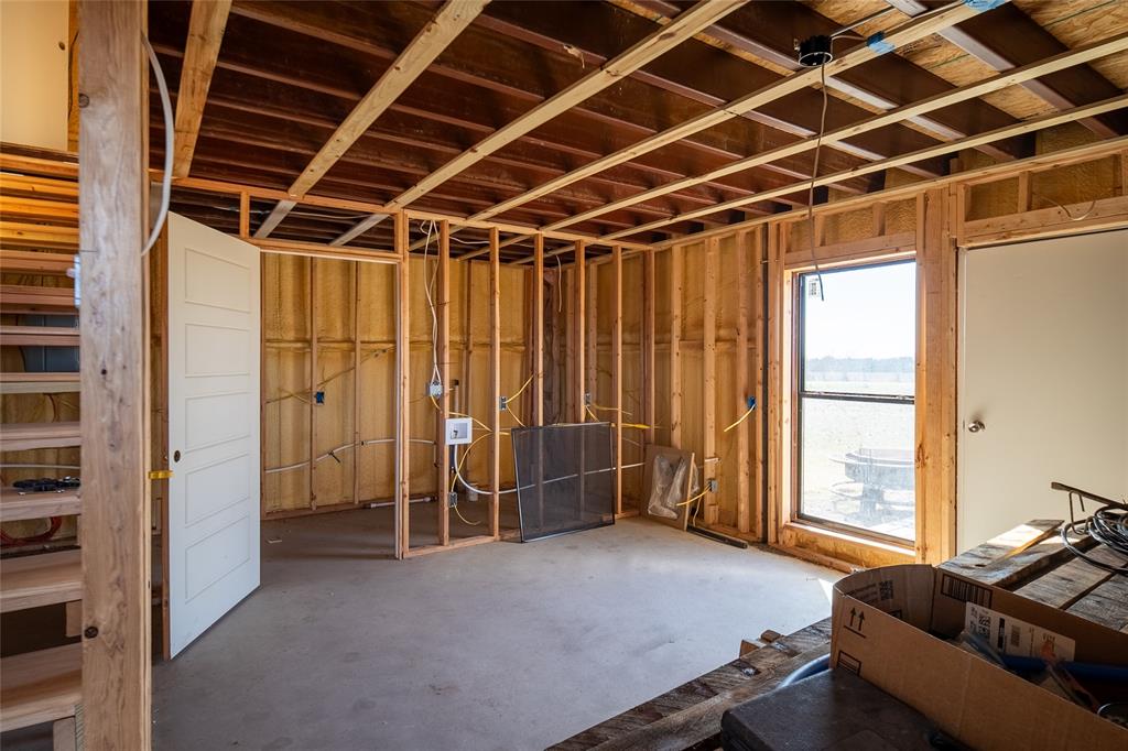 375 Wolf Front Road Van Alstyne, TX 75495 - Photo 23 of 40 a livingroom with furniture and windows