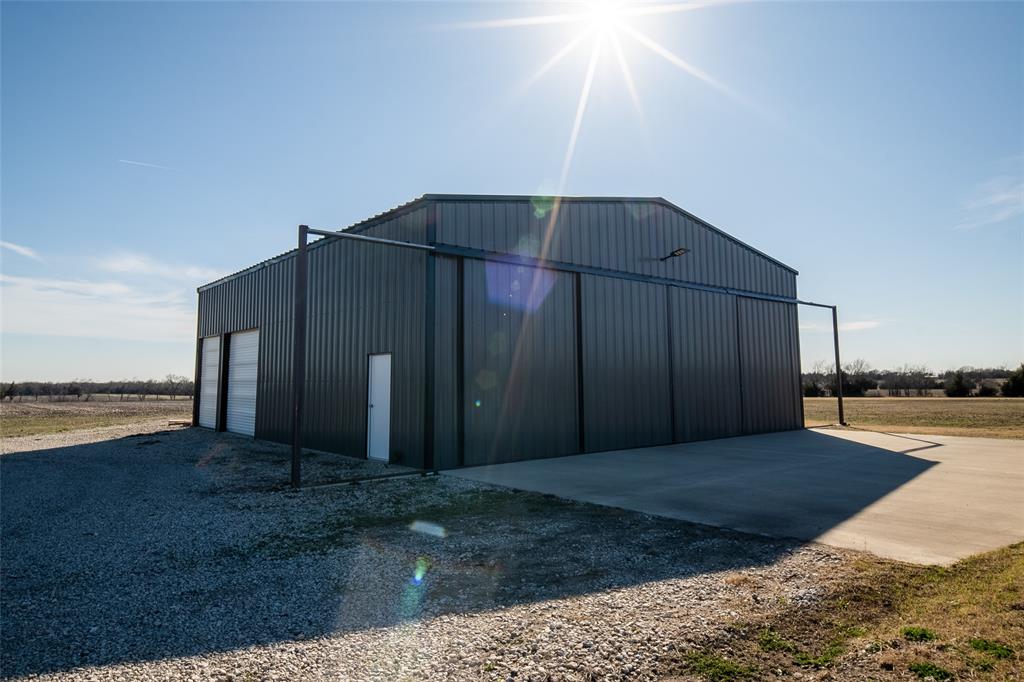 375 Wolf Front Road Van Alstyne, TX 75495 - Photo 35 of 40 a view of a house barbeque oven and lake view