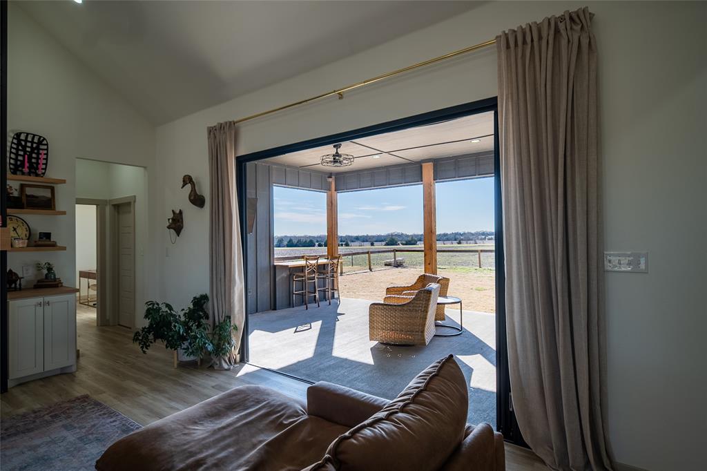 375 Wolf Front Road Van Alstyne, TX 75495 - Photo 6 of 40 a living room with furniture and a large window