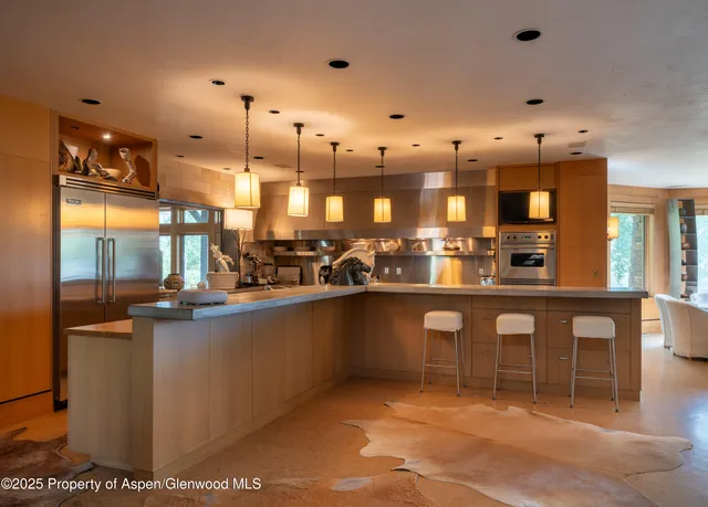 a kitchen with lots of counter space cabinets and appliances