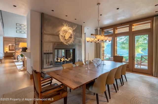 a view of a dining room with furniture window and outside view