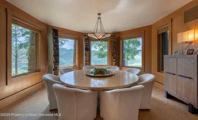 a view of a livingroom with furniture and a window