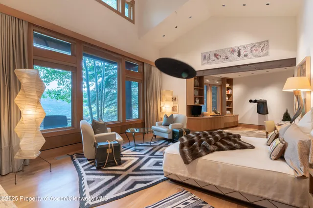 a bathroom with a glass door shower a sink and a mirror