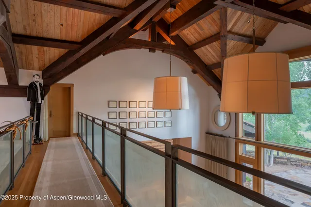 a view of a field with an trees in the background