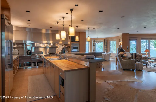 a large kitchen with lots of counter space and windows