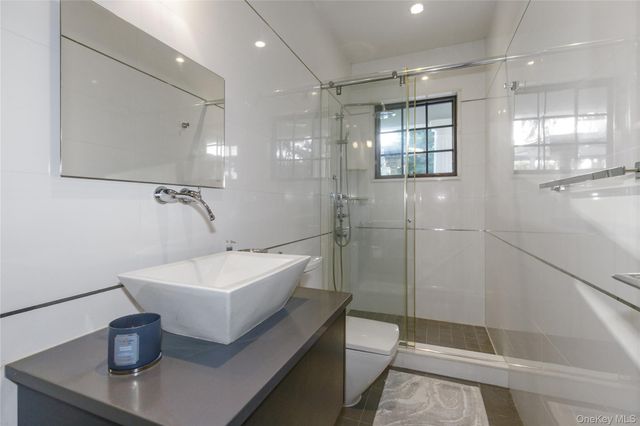 a bathroom with a sink and mirror