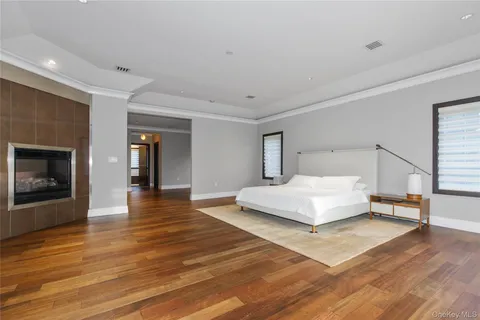 a bedroom with a bed and a fireplace