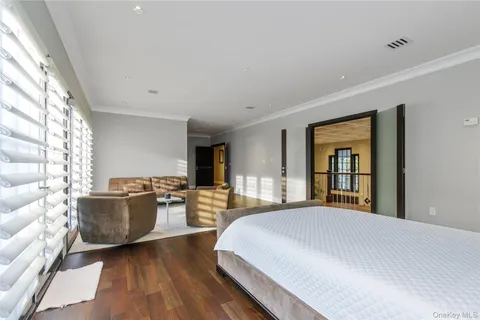 a spacious bedroom with a large bed and a couch