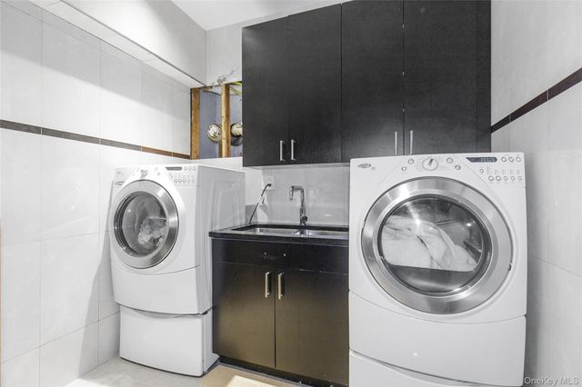 a utility room with dryer and washer