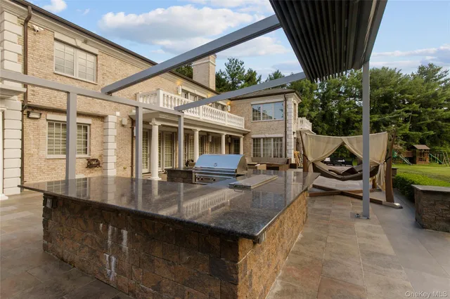 a view of a swimming pool with outdoor seating