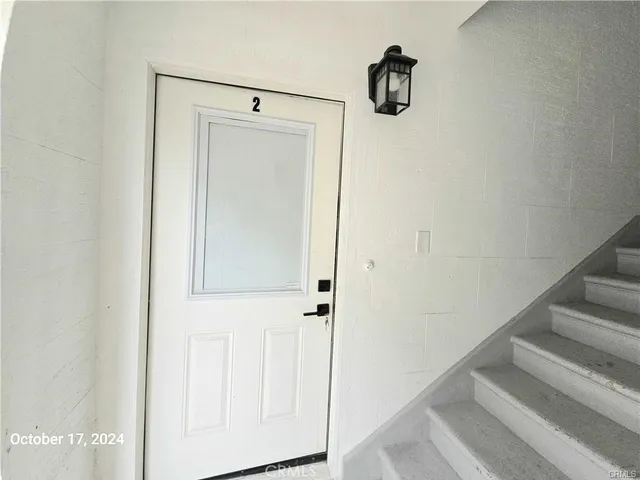 a view of staircase with white walls