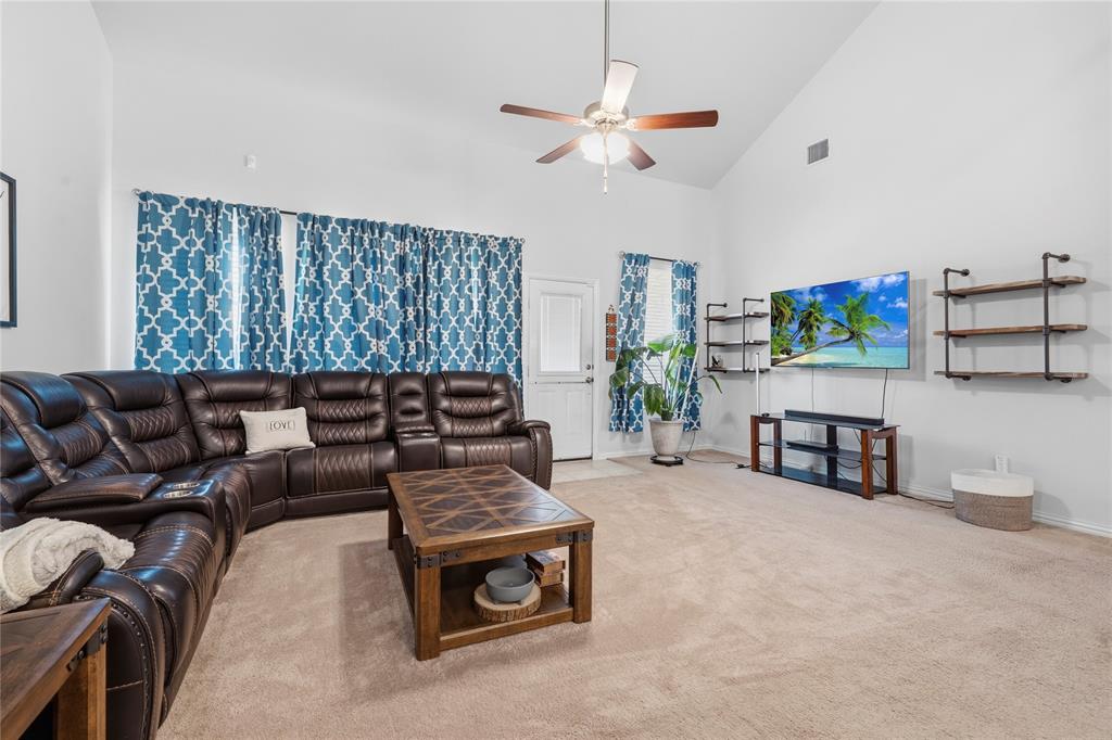 4542 Kipling Avenue Aubrey, TX 76227 - Photo 10 of 34 a living room with furniture and a large window