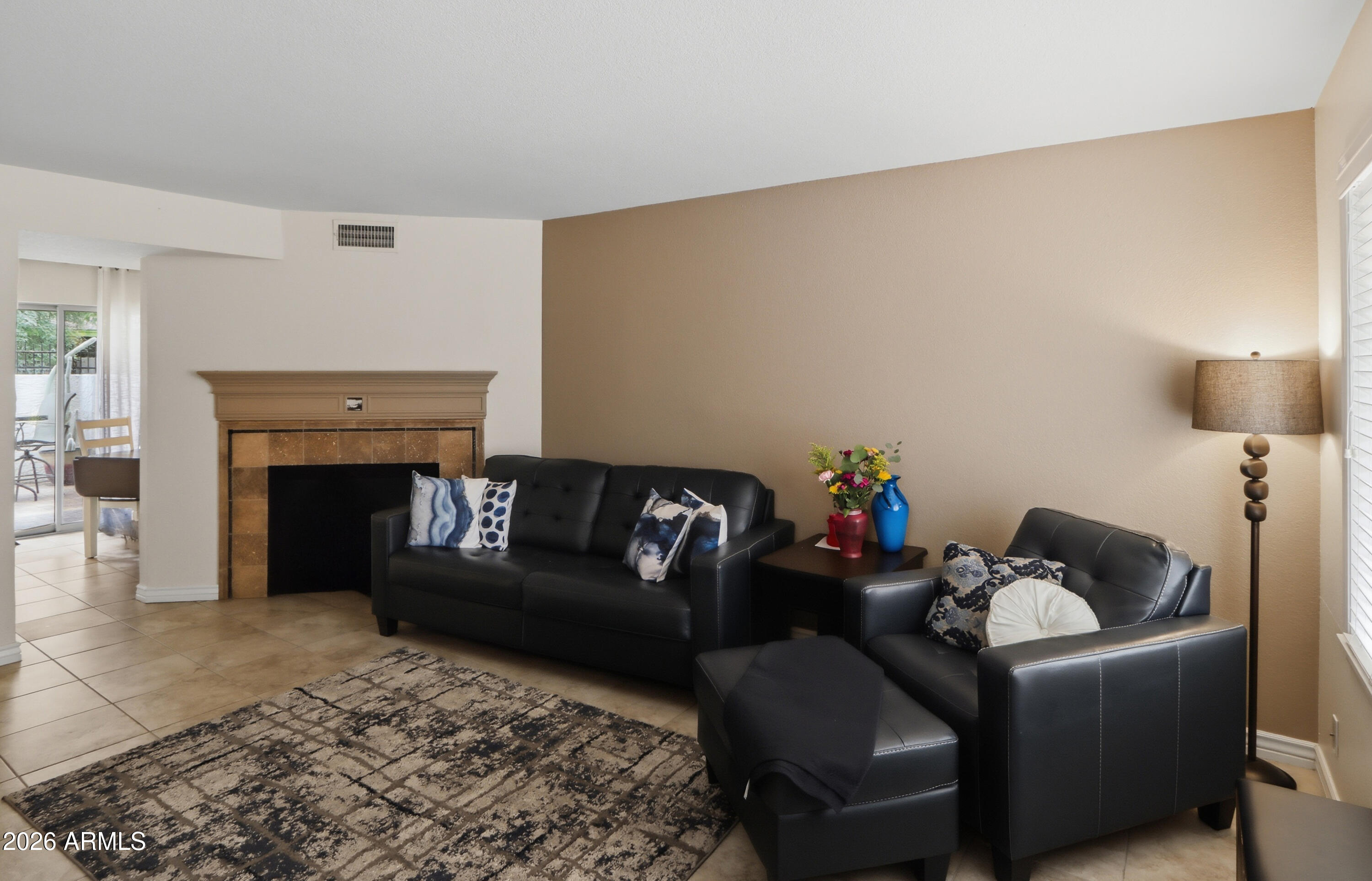 1402 East Osborn Road, Unit 2 Phoenix, AZ 85014 - Photo 2 of 29 a living room with furniture and a fireplace