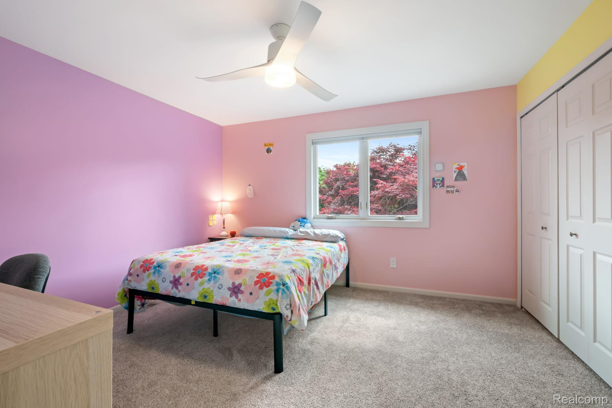 1902 Grayslake Drive Rochester, MI 48306 - Photo 41 of 76 Wall-to-wall carpeting and a modern ceiling fan with integrated lighting