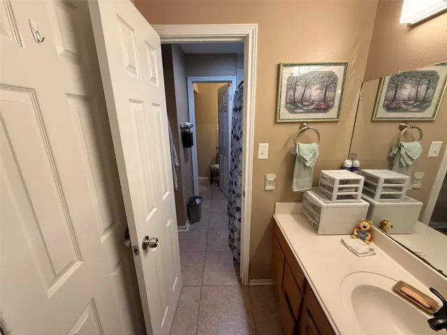a bathroom with a sink a vanity and a mirror