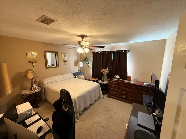 a bed room with a bed and a mirror