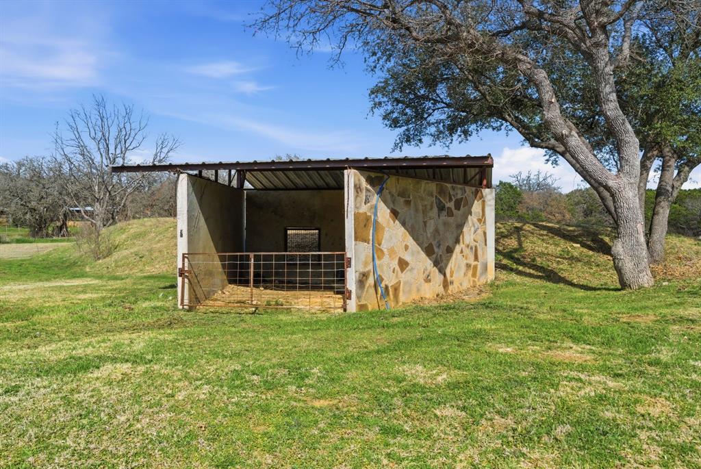 1601 A Stafford Road Weatherford, TX 76088 - Photo 21 of 34 a view of a house with backyard and a tree