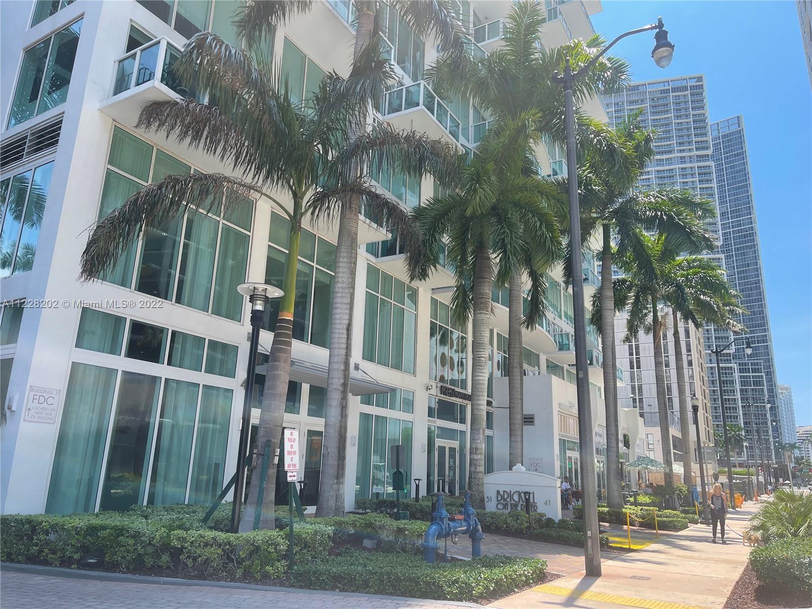 41 Southeast 5th Street, Unit 702 Miami, FL 33131 - Photo 11 of 23 a view of a building with a tree