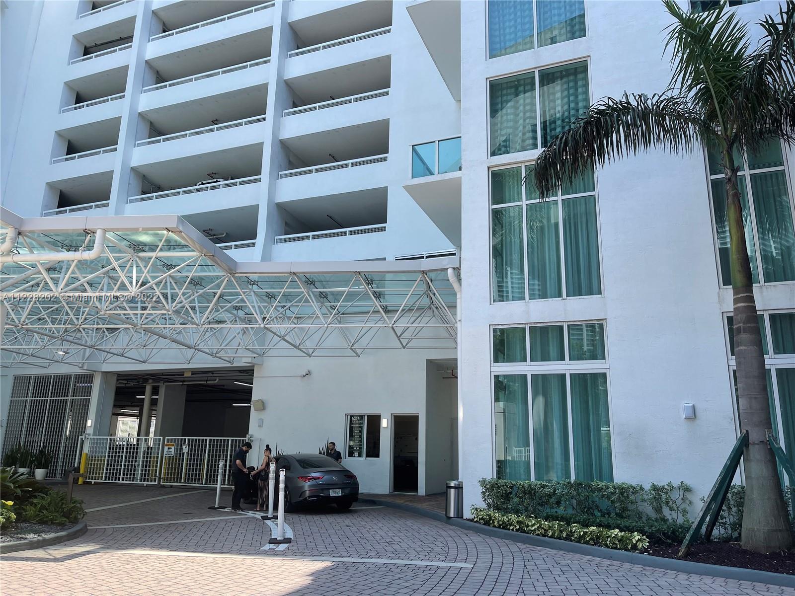 41 Southeast 5th Street, Unit 702 Miami, FL 33131 - Photo 8 of 23 a view of a building with a outdoor space