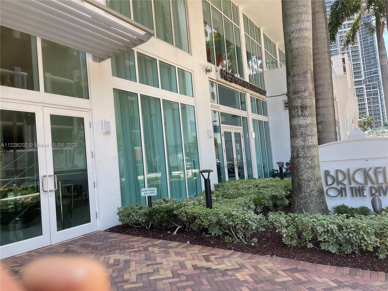 41 Southeast 5th Street, Unit 702 Miami, FL 33131 - Photo 9 of 23 a view of a building with a garden