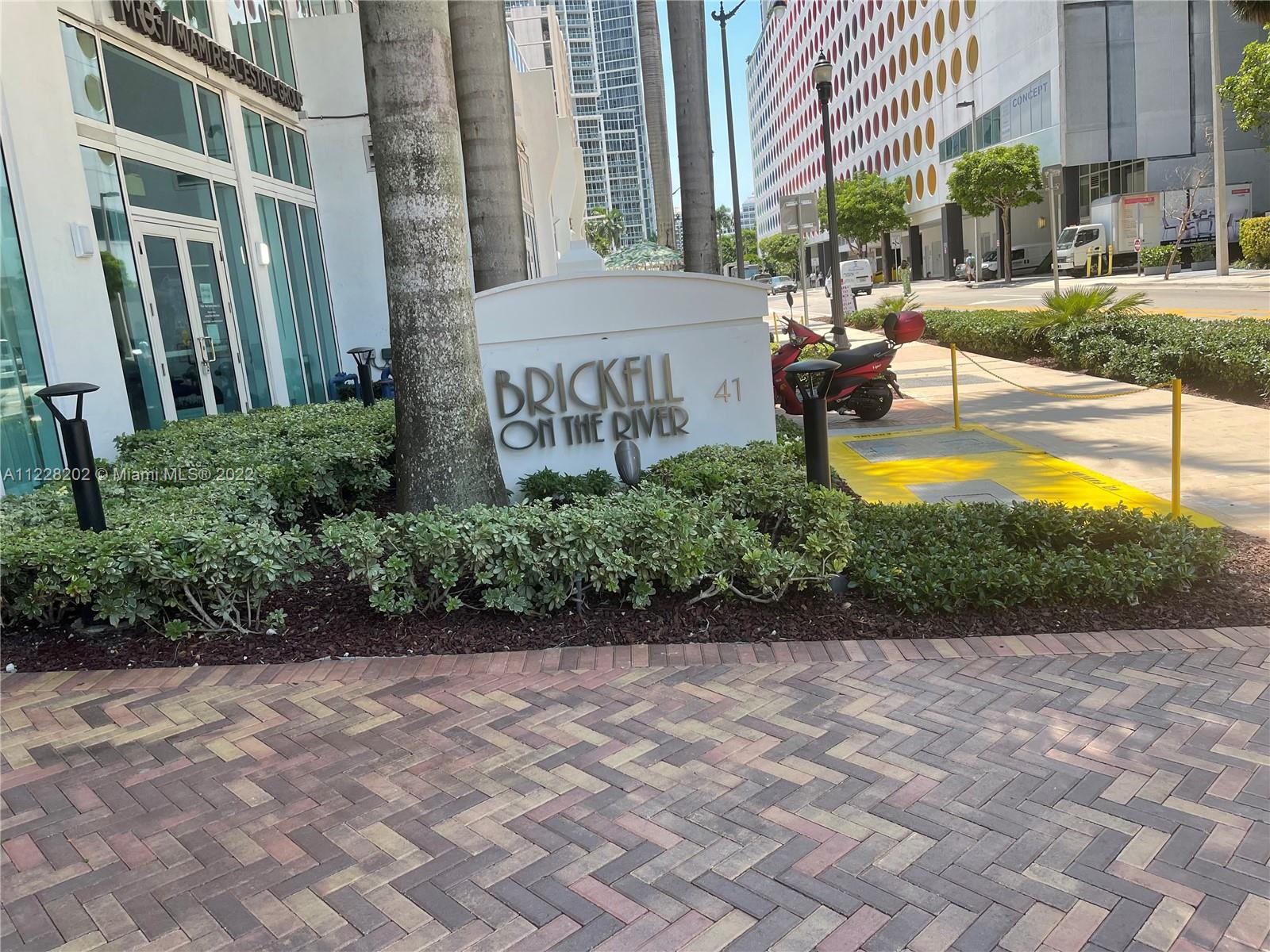 41 Southeast 5th Street, Unit 702 Miami, FL 33131 - Photo 10 of 23 a view of a swimming pool with a patio