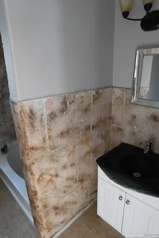 a bathroom with a sink and a mirror