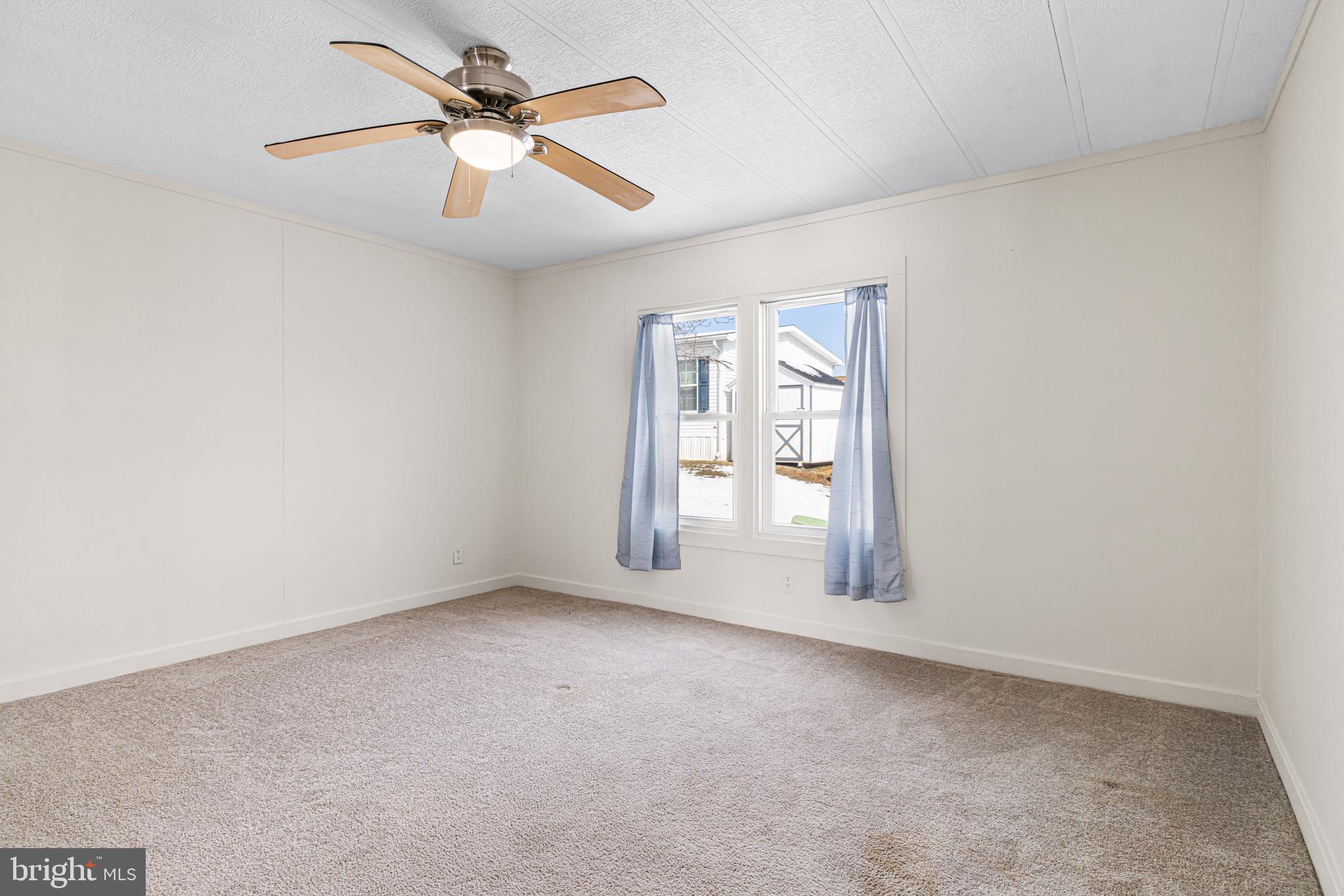 254 Rabbit Run North Wales, PA 19454 - Photo 17 of 22 an empty room with windows and fan
