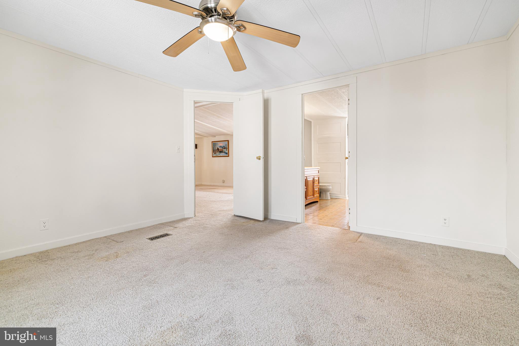 254 Rabbit Run North Wales, PA 19454 - Photo 18 of 22 an empty room with closet and a chandelier fan