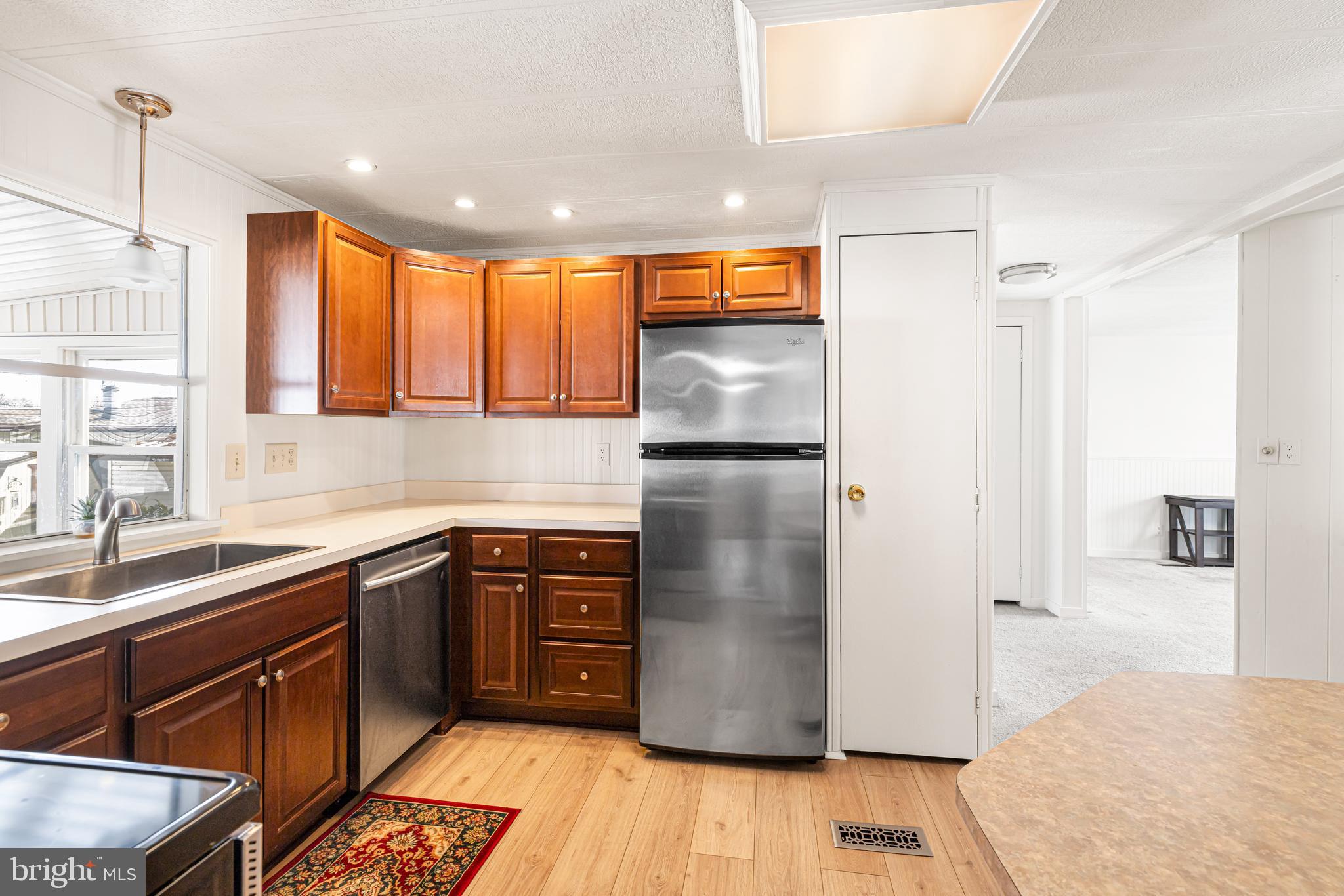 254 Rabbit Run North Wales, PA 19454 - Photo 10 of 22 a kitchen with stainless steel appliances granite countertop a refrigerator a sink and a cabinets