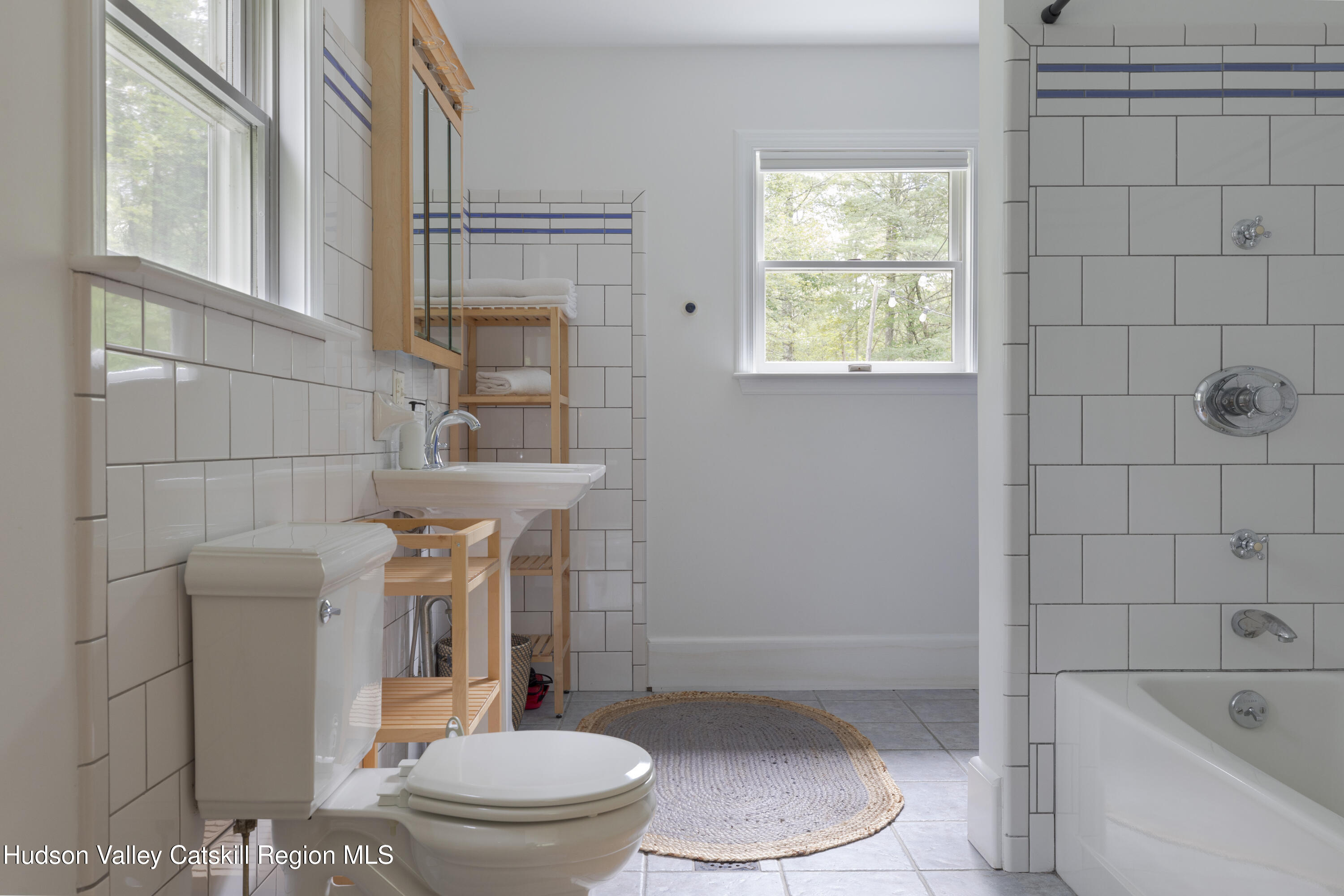 31 Joy Ridge Saugerties, NY 12477 - Photo 12 of 39 a white toilet sitting next to a bath tub and shower